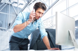 stock photo 19421791 businessman on cell phone e1402332437975